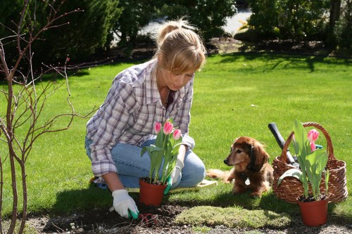 Gardeners wearing PPE and following safe working procedures